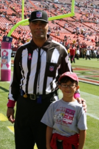 My son with the NFL ref sporting pink wristbands and ribbon
